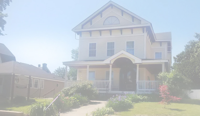 The cream Victorian with burgundy porch at 20 Springfield Street