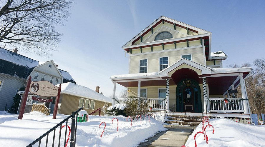 Naomi's Inn, a cream Victorian with a burgundy porch at 20 Springfield Street